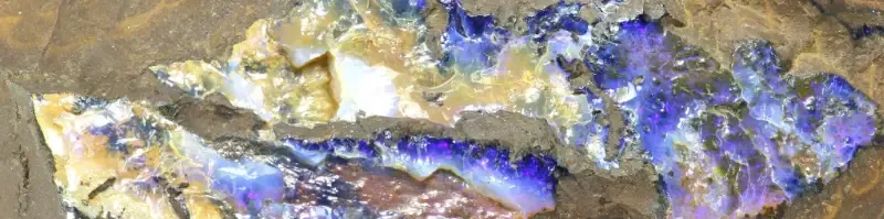 Raw boulder opal in ironstone